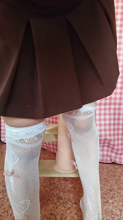 Watch as a girl in white stockings impales herself on a monster dildo