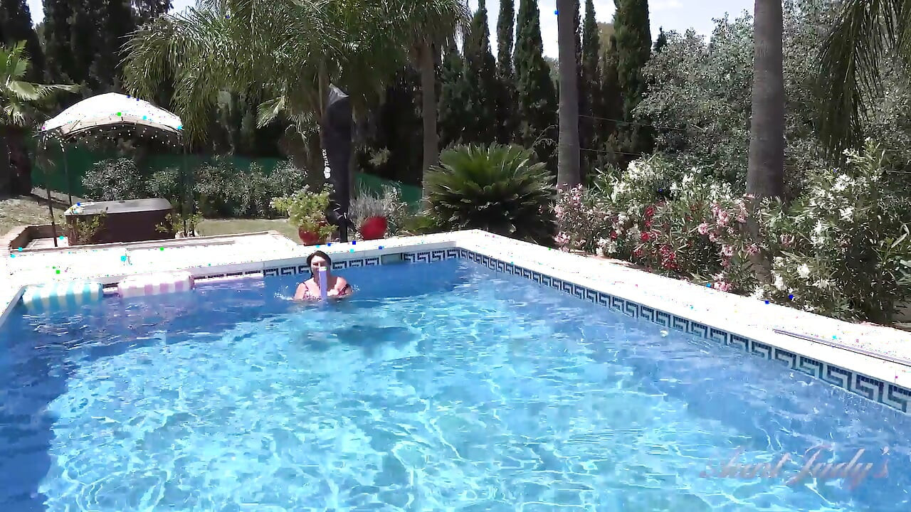 Busty Redhead MILF JoJo Robinson Goes Skinny Dipping in the Pool