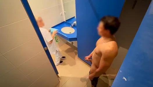 I surprise the cleaning lady at the gym giving me a handjob in the bathroom and she helps me finish cumming with a blowjob