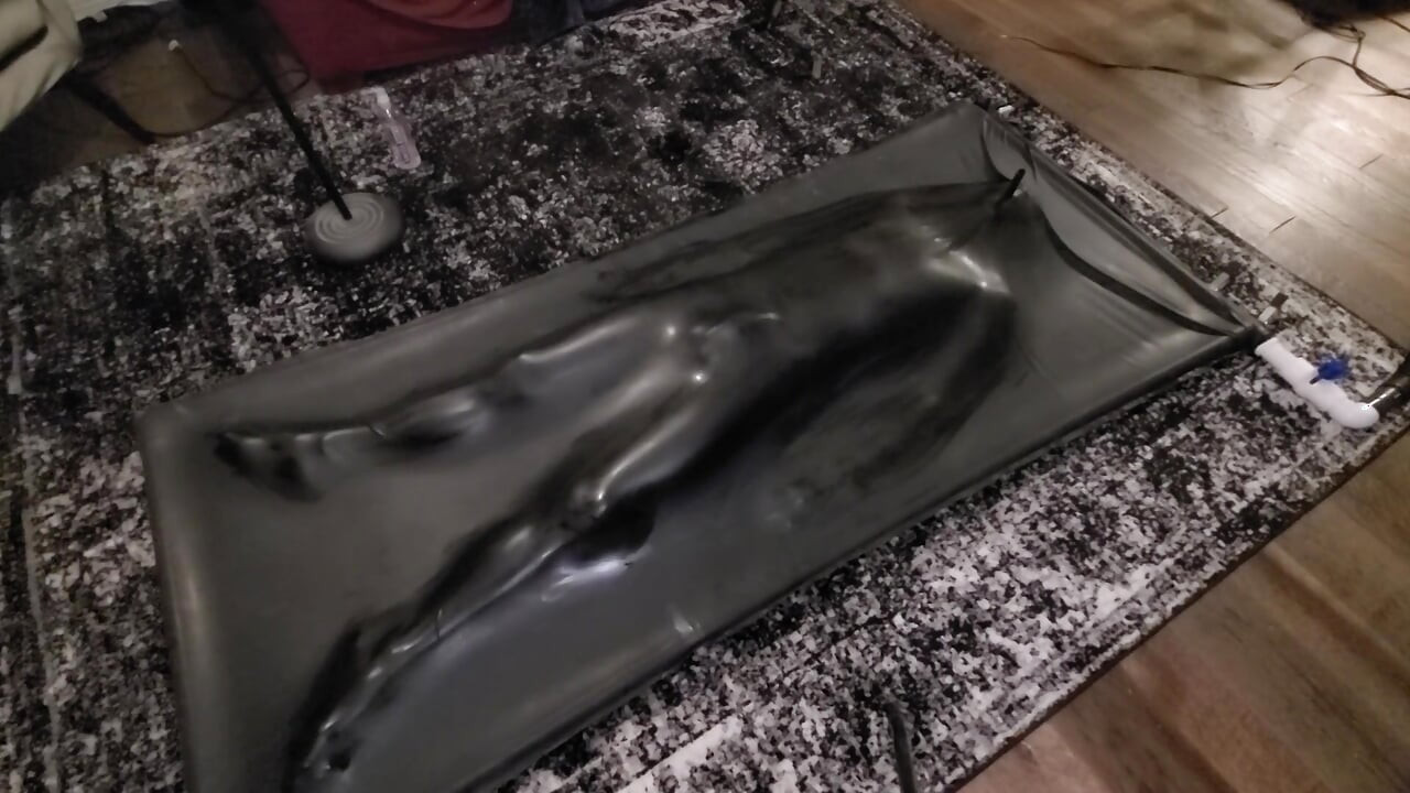 Cute twink tormented in latex vacbed