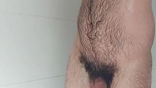 Hairy boy showers and locks up his cock