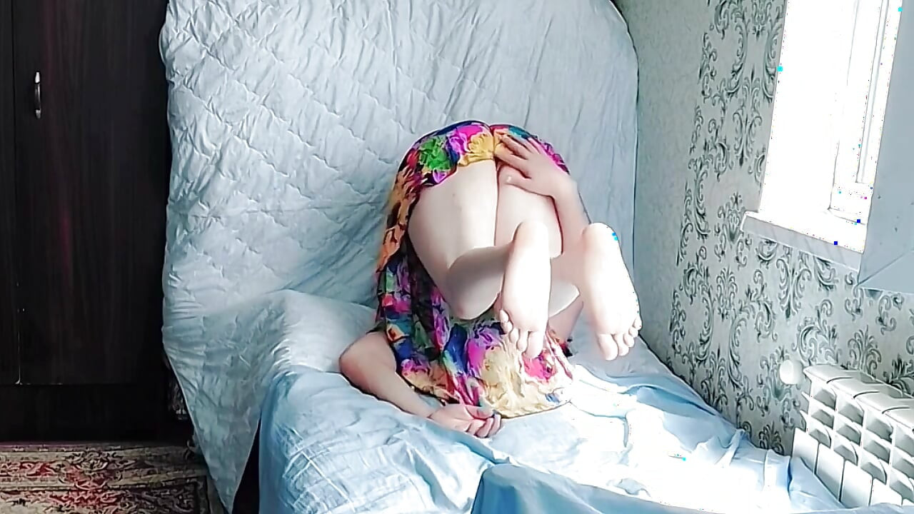 Cute femboy holding flowers while looking away shyly