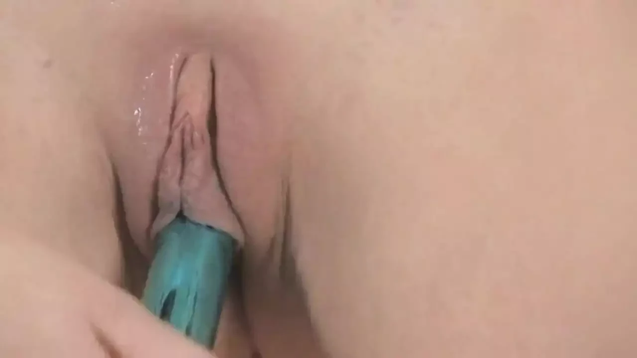 Sexy Brunette Babe Enjoys Big Green Dildo