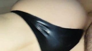 Fucking my wife's big ass in latex strings at home