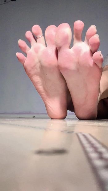 Your cock throbs through my sexy soles.