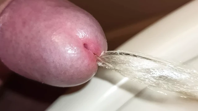 Extreme close-up of uncut cock, pissing!