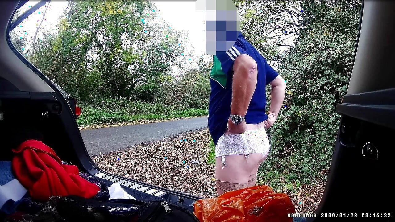 Just getting changed parked at side of road with cars driving past