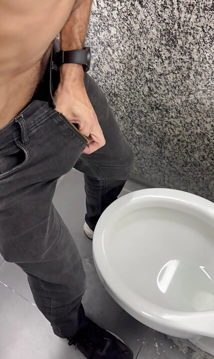 Hairy daddy’s thick 9-inch cock exploding in the bathroom freeballing in jeans