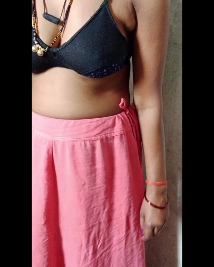 Bhabhi is showing her big breasts while wearing a bra