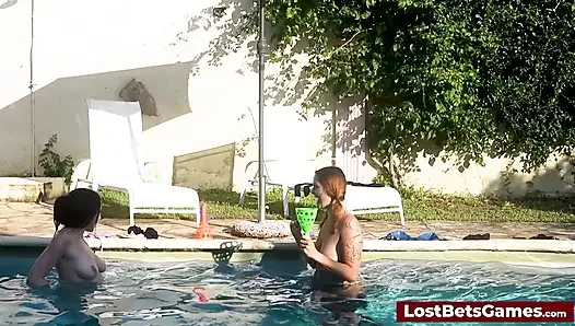 A strip down game outdoors in the swimming pool