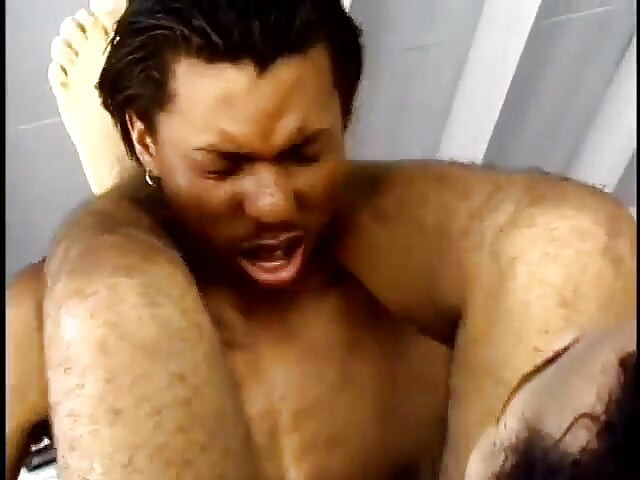 Black stud enjoys his boyfriend sucking his tool while sitting on a chair