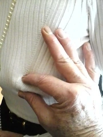 pinching caro's tits at the desk