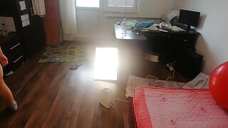 Amateur wife dancing naked at home. Amateur woman has fun trying on clothes and cutting them.