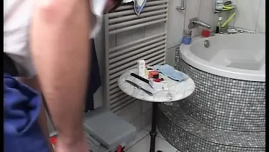 German blonde doll in red lingerie sucks dick in the bathroom