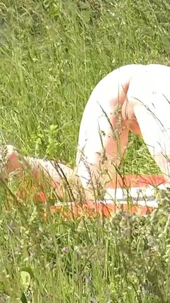 Iconic moment from "Milf sexy woman sunbathing naked on river bank. Naked in public. Wild beach Nudist. Ass. Pussy. Blonde."