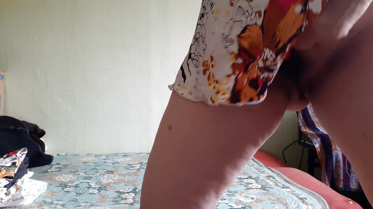 A passionate, milf woman intensely stimulates her hairy clitoris with a vibrator and cumming trembling all over