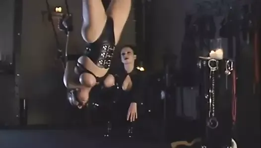 latex lesbian hanging upside down played by mistress