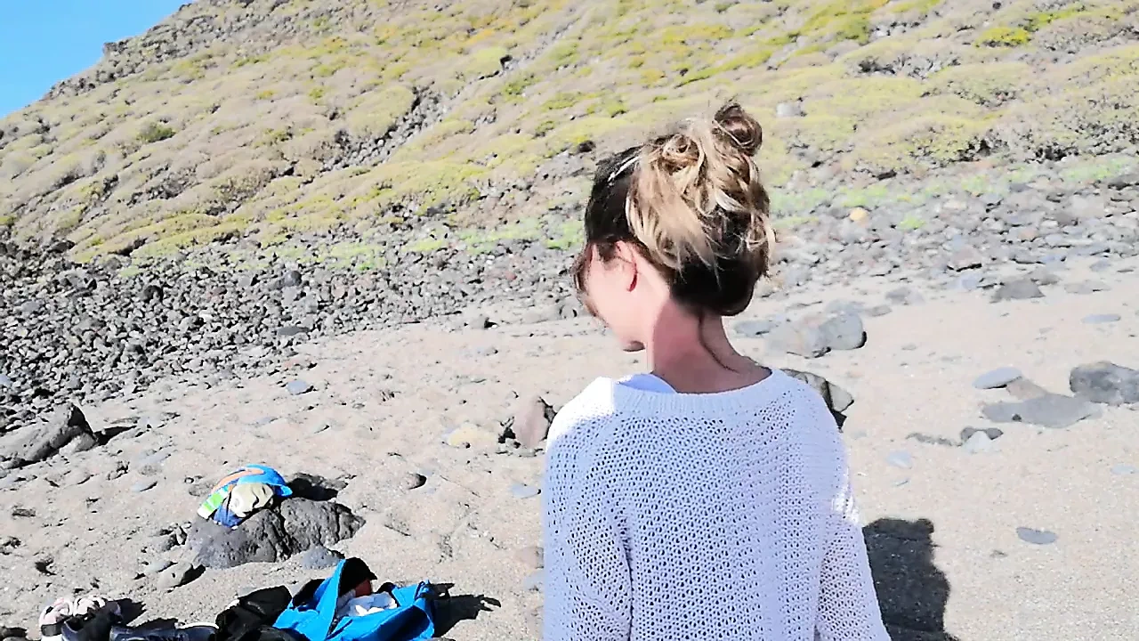 A strange blonde girl gives me a blowjob on the beach