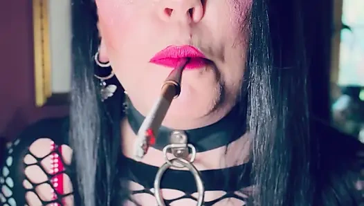 Pink & Delicious Tina Snua Sparks Up A Cigarette In A Holder