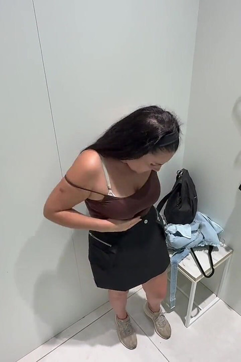 Mature Woman Trying on Clothes