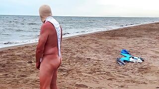 My husband in a chastity cage is exposed on a beach