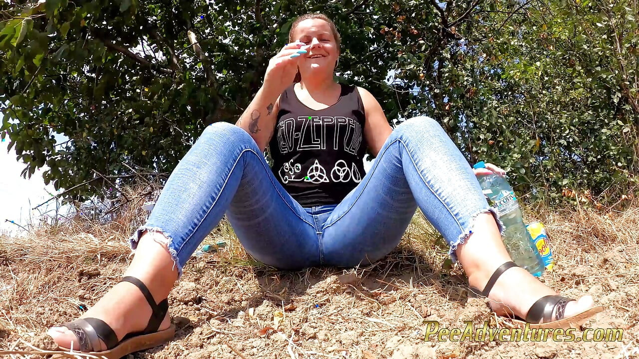 Chubby girl talking on the phone with her boy friend pee in her jeans