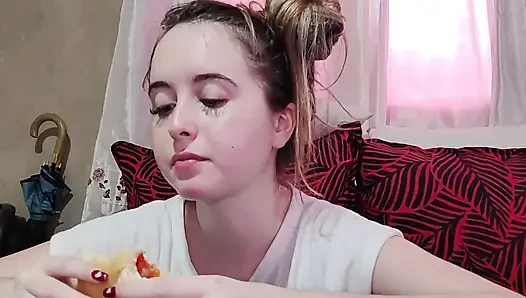 Eating an omelette sandwich with cherry tomatoes