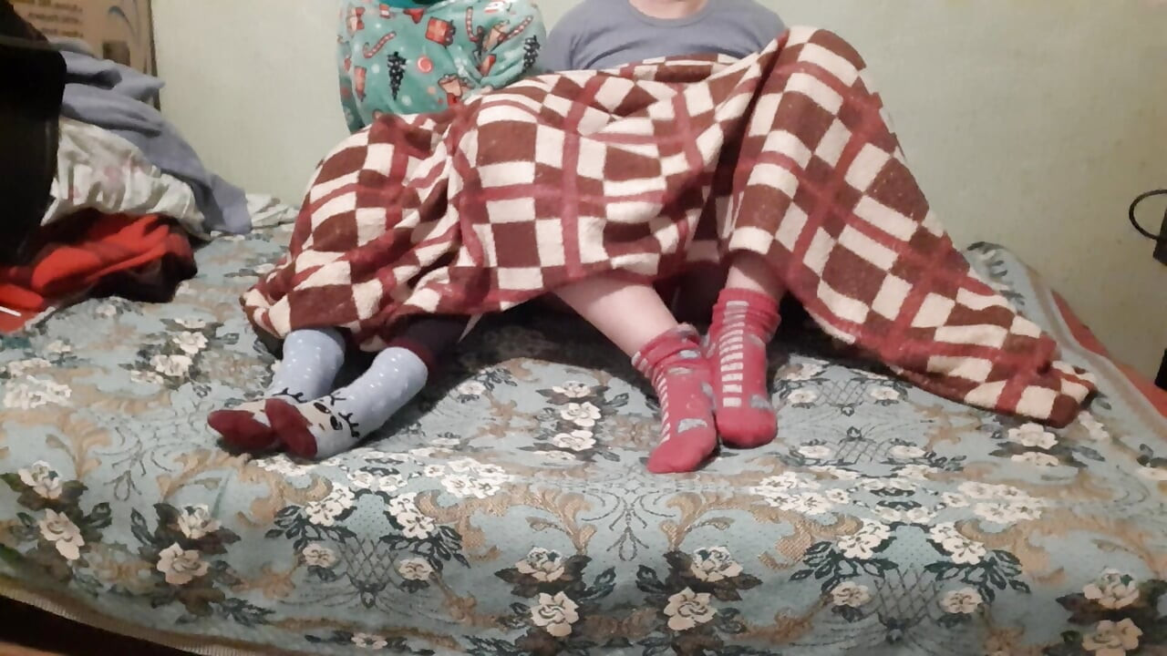 We mutual masturbate under the covers while our stepparents watch a movie next to us