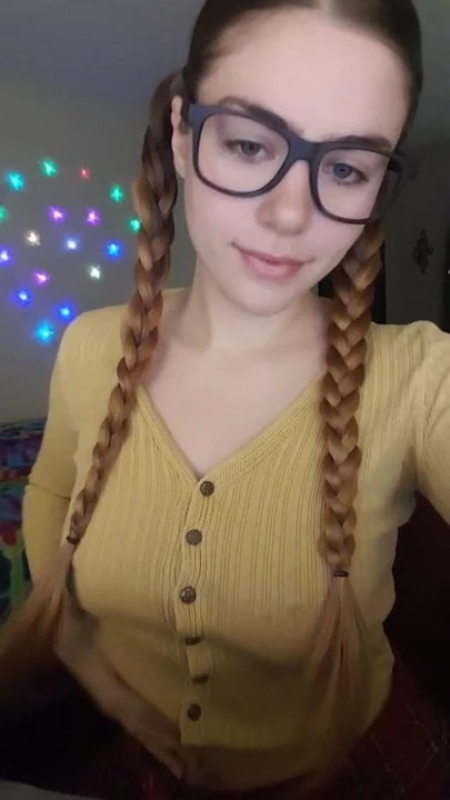 Girl with glasses shows boobs.