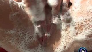 Maria Belucci gets wet and soaped up with her luscious tits