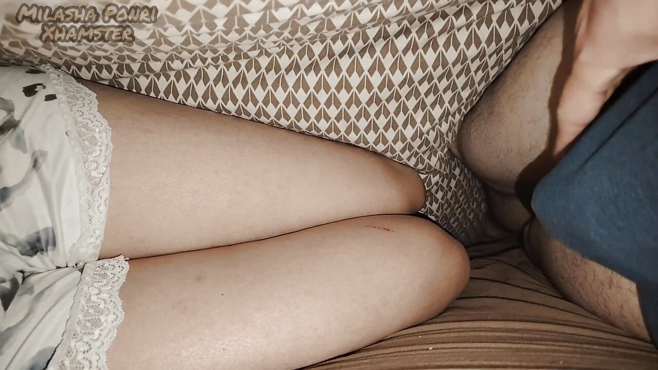 I'm lying next to my stepsister and touching my dick.