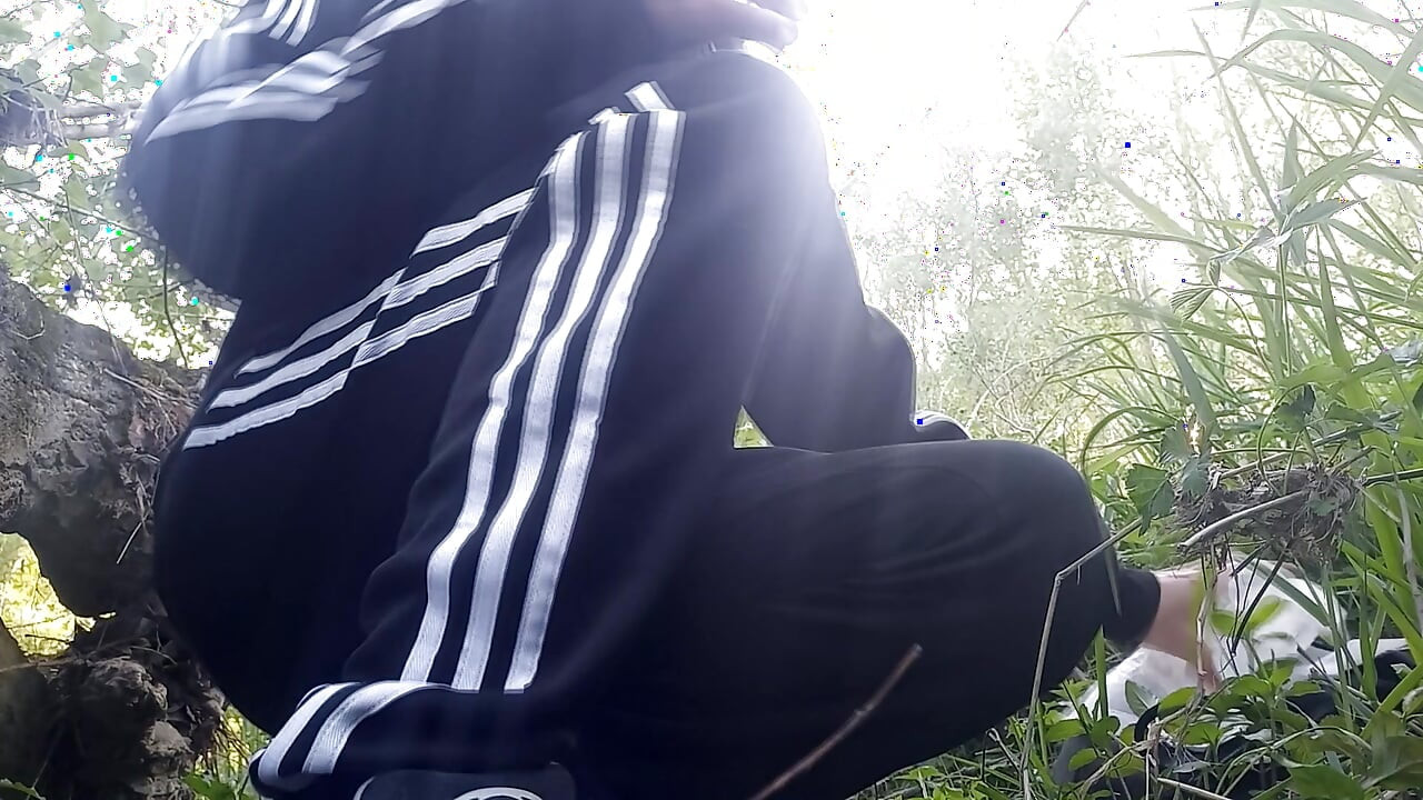 Gay boy Jon Arteen, wearing adidas tracksuit Campus sneakers, gets a hard-on outdoors, jerks off, squirts big cumshots before cl