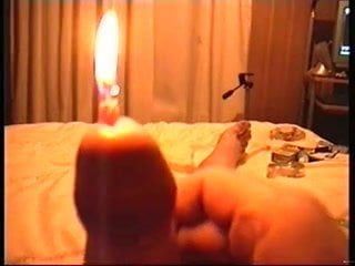 Burning candle in peehole