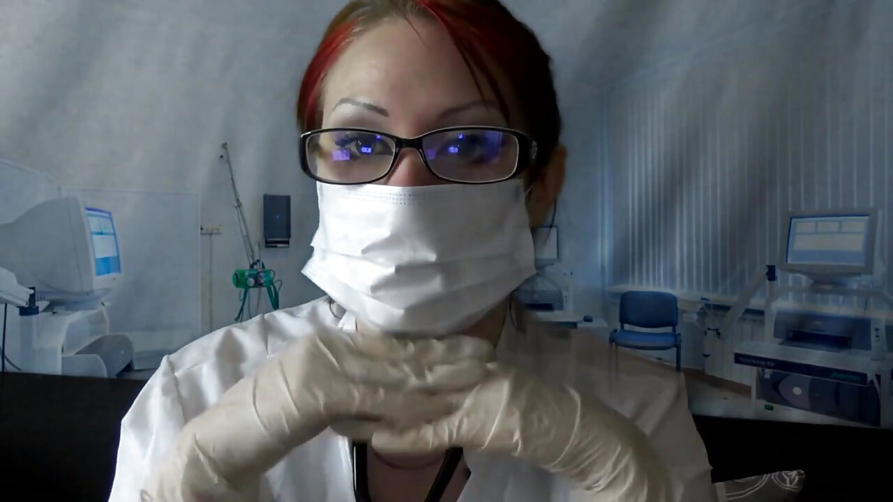 Doctor eating in medical mask and gloves