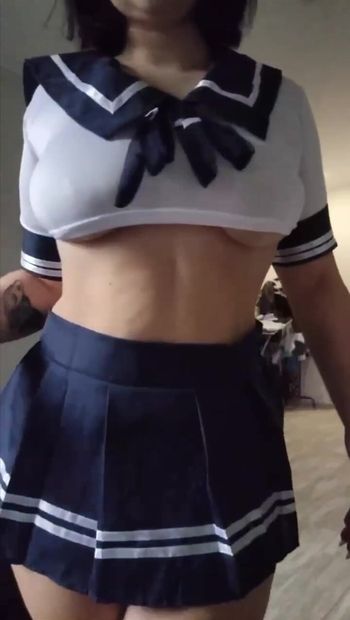 Cutie twirls her ass in a short skirt