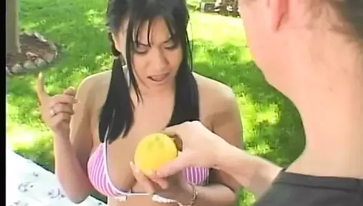 A busty Asian gets a creamy facial after a rough outdoor fuck