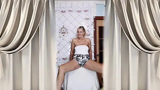 Housewife Lukerya warms up in the kitchen and flirts playfully on webcam.