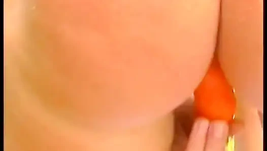 Hairy blonde chick fills her pussy with carrot outdoors