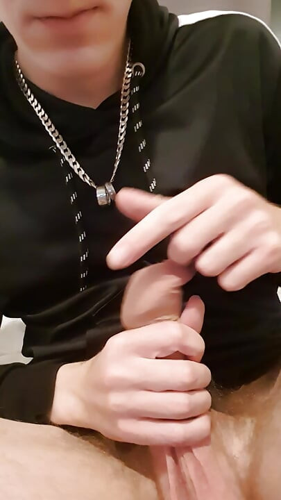 Young horny lad close-up of massive uncut cock