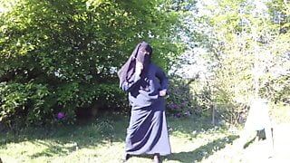 Muslim in burqa and stockings – flashing outdoors