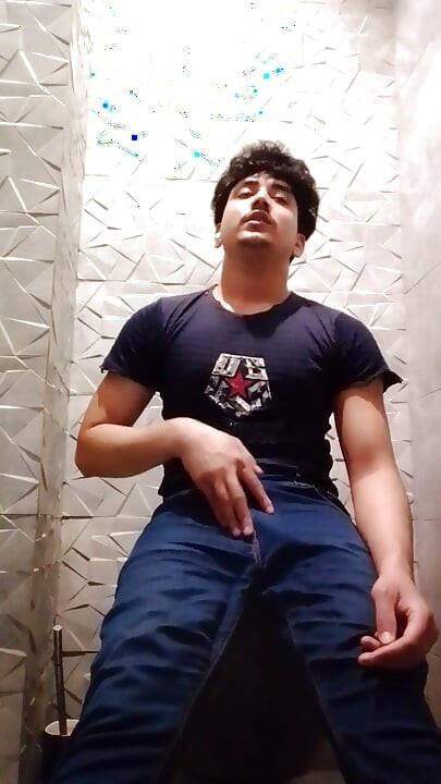 Indian Handsome Boy While His Hard Penis Is Erect and He Strokes His Hand Again in the Toilet Video