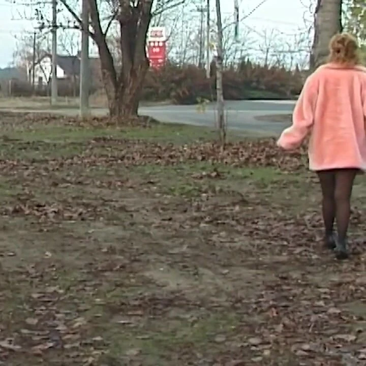 Redhead wife pissing in outdoor