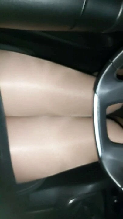 With shiny pantyhose and Katty Perry on the road by car
