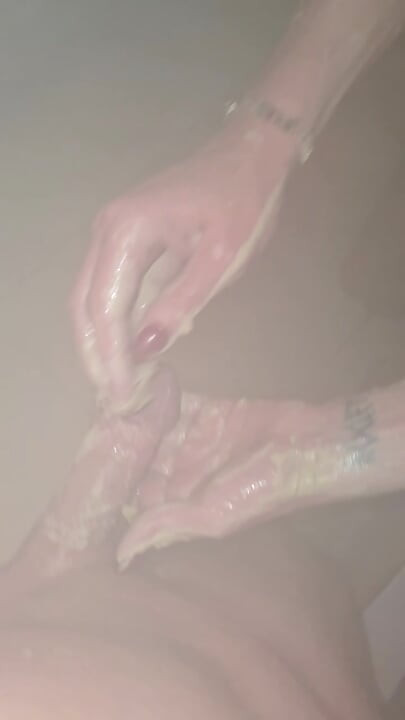At the sauna I suck his big cock and rub the massage mud all over and make him blow a load all over my tits!