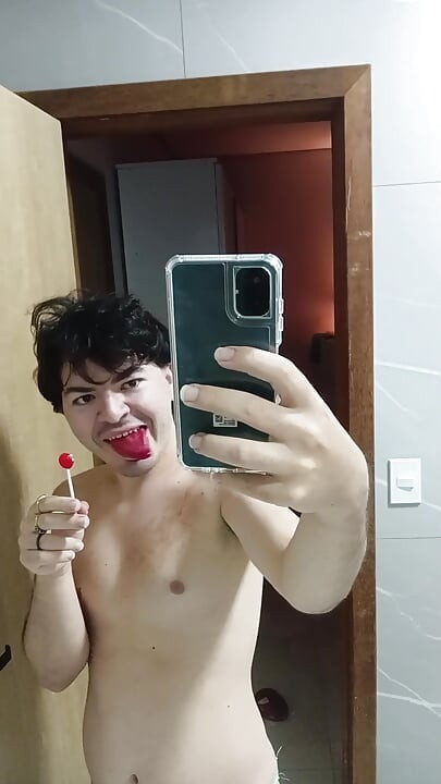 gay femboy sexy skirt lingerie and licking lollipop
