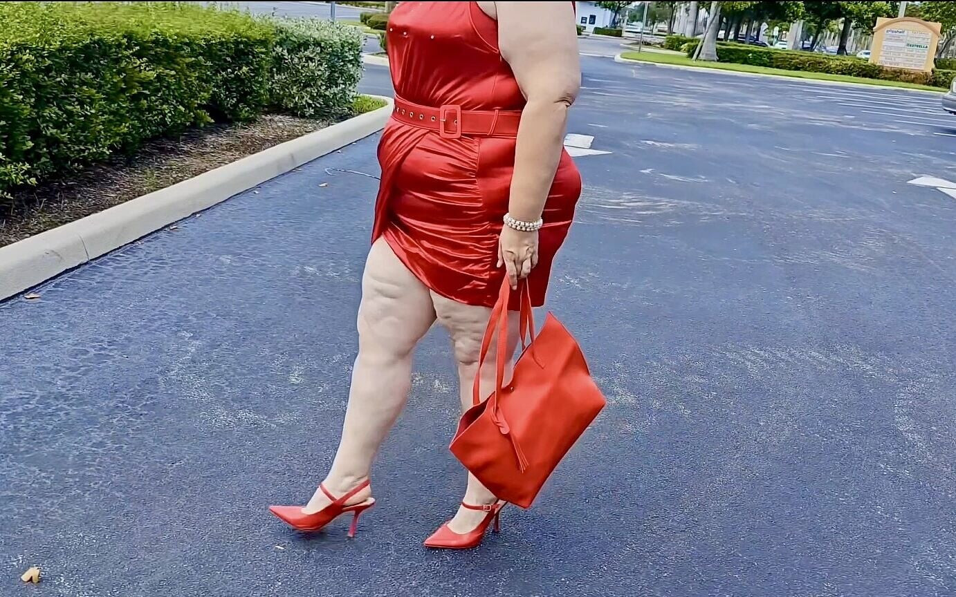 Beautiful Woman Walking Outdoors in  Parking Lot Showing off for Strangers