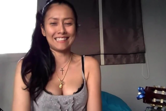 Thai Girl Show Her Cleavage While Singing