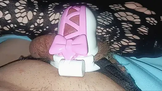Playing with hubby in his pretty pink ribbon chastity.