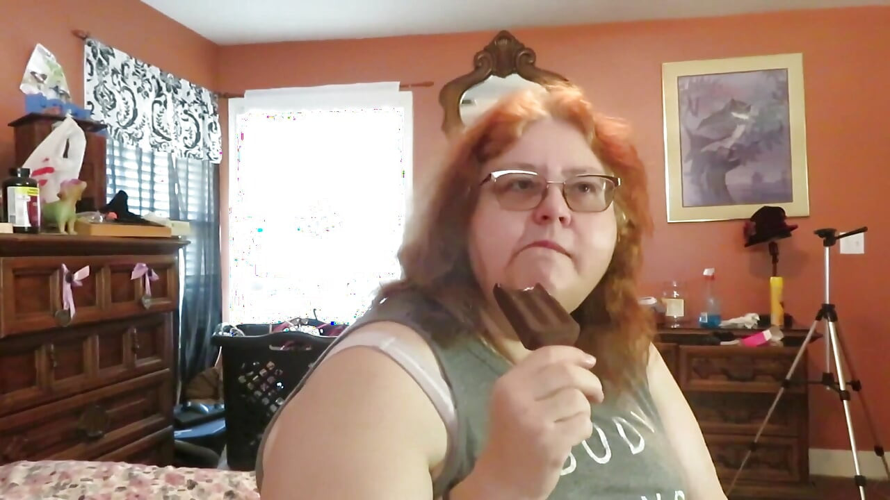 BBW nurse Vicki enjoys eatting a chocolate vanilla ice cream popsiscle