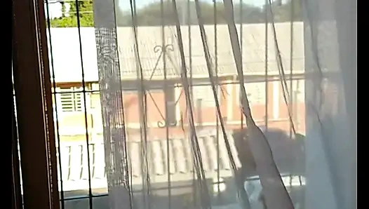 My stepmother trimming her hair and showing off to the street, filmed and sent me and asked if it was good.